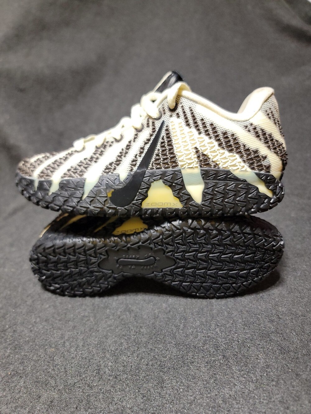 Nike Kids Black and Cream Athletic Sneakers with Yellow Accents